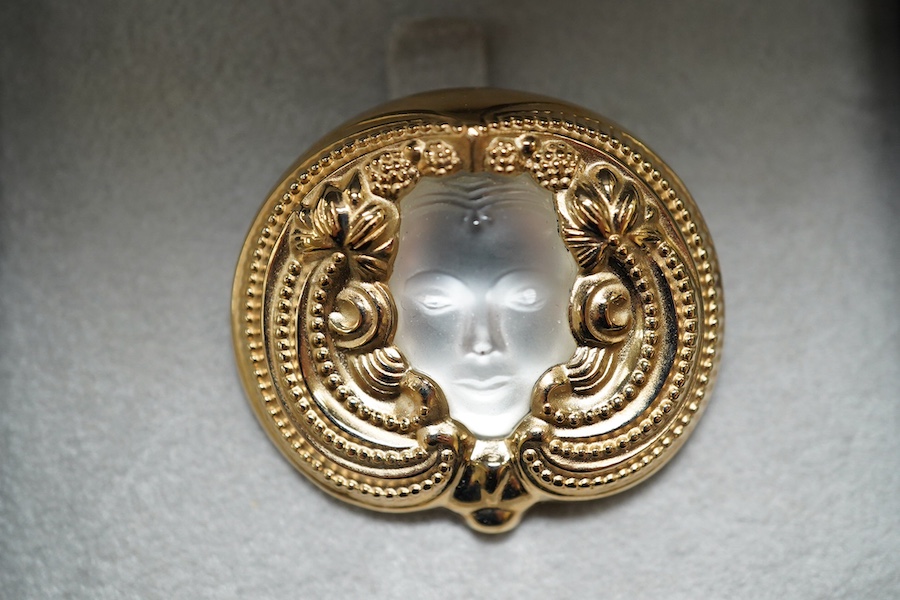 A Lalique mask brooch, cased